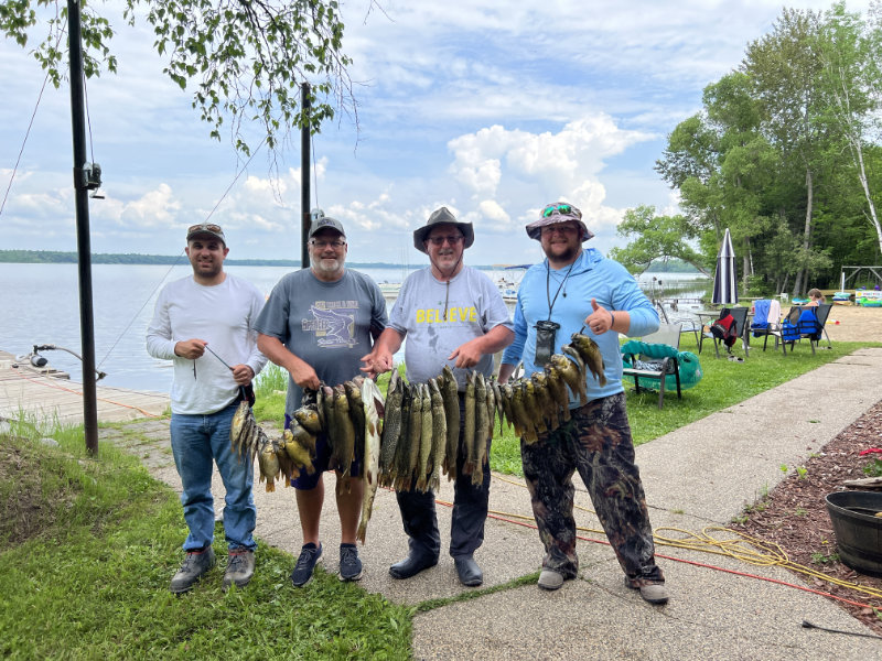 Four guys with a big stringer of fish caught on Gull Lake